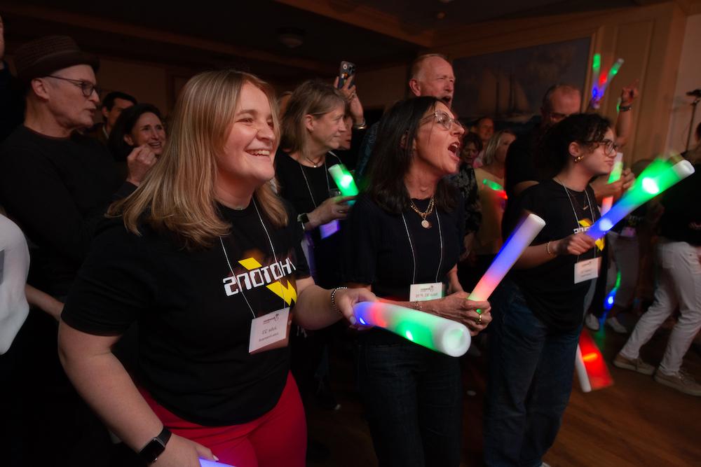 Group smiling holding glow sticks